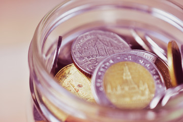 Thai baht coins in jar