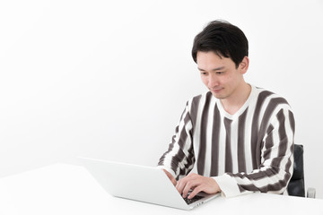 portrait of casual asian man on white background