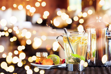 Camomile tea with dried fruits. Spa time concept. Spa lounge area. . Bold festive bokeh