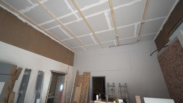 Panning through a small indoor construction site