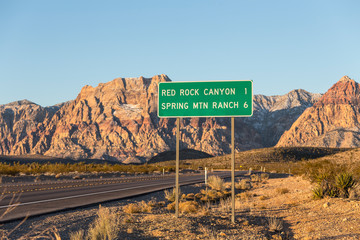 Early morning view of route 159 highway sign and desert cliffs near Red Rock Canyon National...