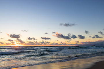Fototapeta na wymiar Beautiful orange sunset over Pacific Ocean from Manhattan Beach, California