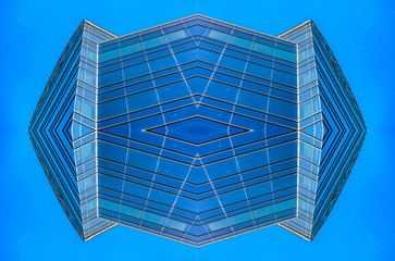 Abstract blue glass building in downtown grid