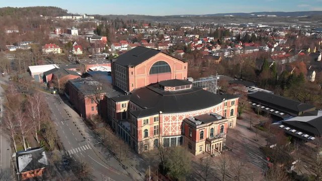 Aerial Shot of famous Festival Theatre in Bayreuth. 
Camera Tilting down while flying up.
Shot in 4k at 24fps.