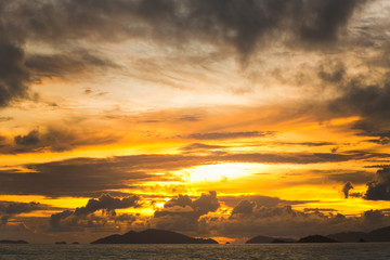 Naklejka na ściany i meble Dramatic sky at sunset in Hawaii ocean