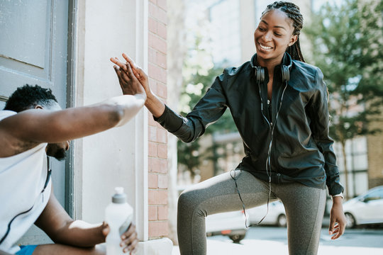 Fitness partners giving each other a high five