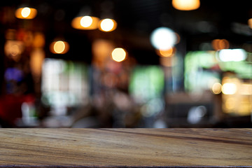 wooden table in front of the blur background