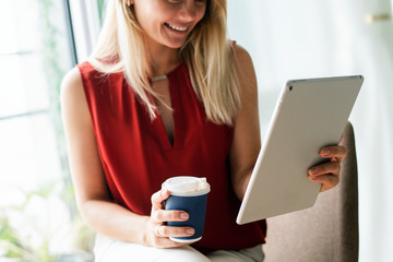 Businesswoman reading thew news from a digital tablet