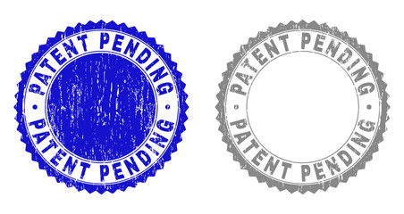 Grunge PATENT PENDING watermarks isolated on a white background. Rosette seals with grunge texture in blue and grey colors. Vector rubber stamp imprint of PATENT PENDING label inside round rosette.
