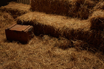 hay stacks in barn house with zinc wall © bennnn