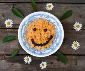 Bowl of oatmeal porridge with fresh strawberries and raspberries.Healthy breakfast. Flat lay, top view, copy space. Morning healthy breakfast.Close up. Healthy food, healthy breakfast concept.