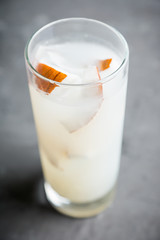 Sweet coconut cocktail on the wooden background. Selective focus. Shallow depth of field.