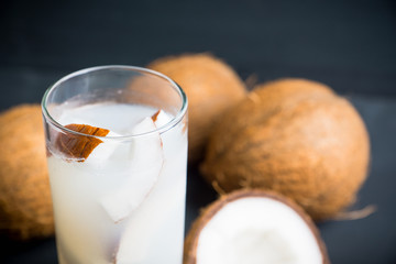 Sweet coconut cocktail on the wooden background. Selective focus. Shallow depth of field.
