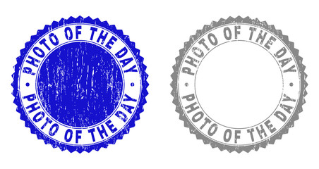 Grunge PHOTO OF THE DAY stamp seals isolated on a white background. Rosette seals with grunge texture in blue and gray colors.