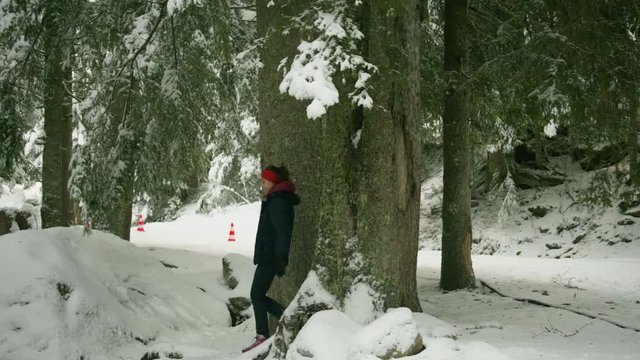 Woman Trekking and Taking Photos in Winter Wonderland.