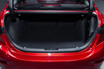 Сlose-up of the car  black interior:   clean luggage boot and car trunk,  front view.