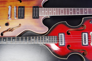 Obraz na płótnie Canvas Two electric guitars on a black background.