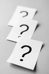 White cards with printed question marks