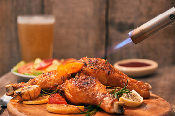 Chef cooking of Crispy Fried Chicken on wooden board background in the restaurants. Foods concept. Warm lights tone.