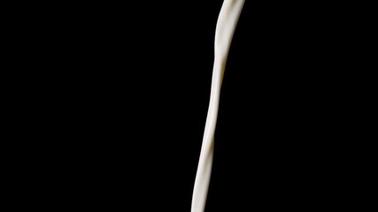 Macro shot of pouring milk in slow motion in front of black background. - Powered by Adobe