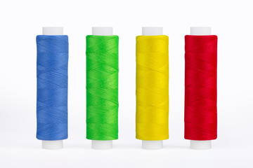 Set of sewing thread coils, miscellaneous colours, isolated on white