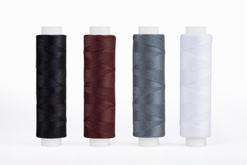 Set of sewing thread coils, miscellaneous colours, isolated on white