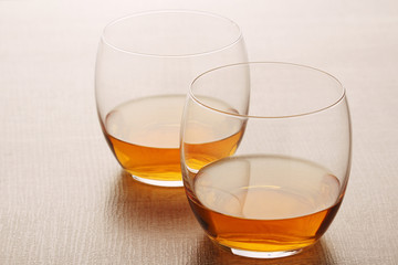 Two glasses with whiskey without ice cubes
