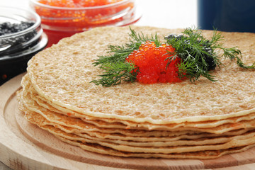 Russian pancakes with red and black caviar