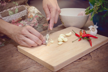 She prepares ingredients for cooking.