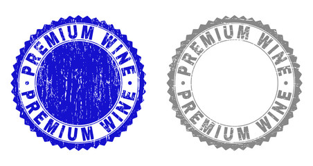 Grunge PREMIUM WINE stamp seals isolated on a white background. Rosette seals with distress texture in blue and grey colors. Vector rubber stamp imprint of PREMIUM WINE label inside round rosette.