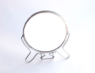 Round desktop small mirror on a white background