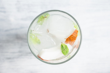 Sweet coconut mojito cocktail on the wooden background. Selective focus. Shallow depth of field.