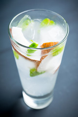 Sweet coconut mojito cocktail on the wooden background. Selective focus. Shallow depth of field.