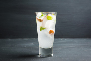 Sweet coconut mojito cocktail on the wooden background. Selective focus. Shallow depth of field.