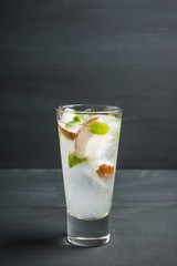 Sweet coconut mojito cocktail on the wooden background. Selective focus. Shallow depth of field.
