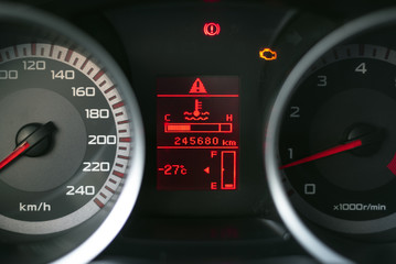 Fototapeta premium Low level fuel symbol on a car dashboard. Need a fueling concept background.