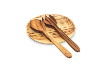 Empty round wooden plate, fork, spoon isolated on white background top view. Handcrafted cooking utensils, dishes from natural materials, kitchen interior items.