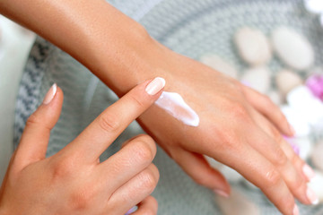 Skin Care Concept. Sp. Beautiful Woman With Hand Cream, Lotion On Her Hands. Closeup With  Natural Manicure Applying Cosmetic Cream On Soft Skin. Beauty Concept