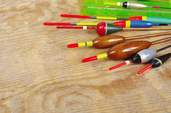 Fishing floats and fishing gear on a wooden table