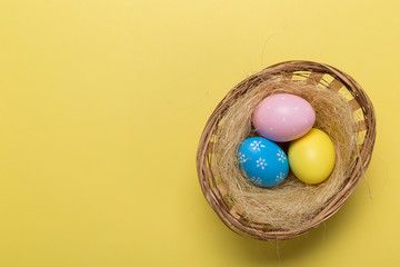 easter eggs on yellow pastel color background with space. Concept
