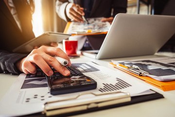 Business team meeting. professional investor working new start up project. Finance task. with smart phone and laptop and digital tablet computer  in morning light