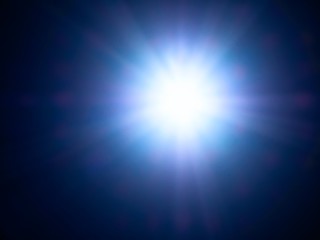 Image of very bright strong sunbeam in summer.