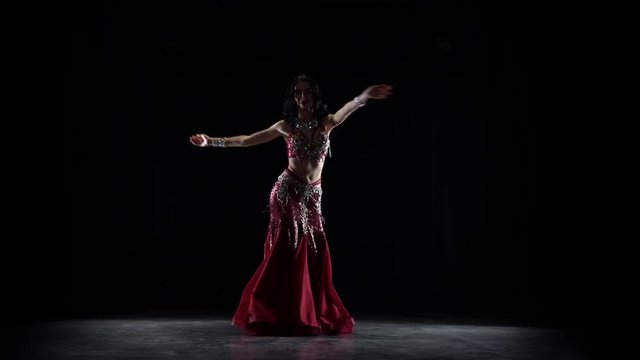 Oriental belly dancer. Black background