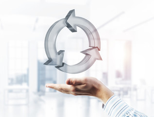 Web refresh icon in male hands as symbol for internet use. Mixed media