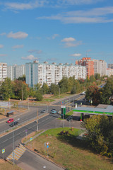 City street, fuel station and forest. Kazan, Russia