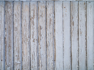 Background a wall from old boards with the cracked paint.