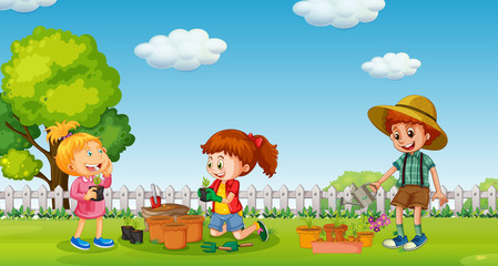 Obraz na płótnie Canvas Children planting tree in pot