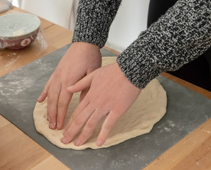 Stretching dough for pizza