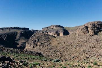 Morocco tourism: trekking man in mountains. Atlas mountains, Jebel Sakhro (Djebel Sahro), Ourzazate, Morocco