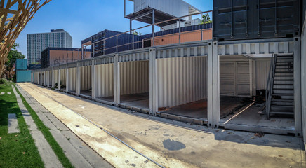 Reused Container; construction budilding in the row beside footpath.